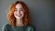 © Raffaza - Happy woman with vibrant red hair in front of a neutral background, Studio Portrait, Possible use for beauty or lifestyle advertising