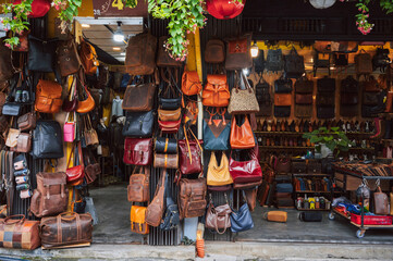 leather bags and accessories store in Hoi An market in Vietnam in Asia