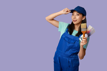 Wall Mural - female asian painter with brush and paint color palettes on purple background