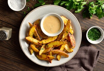 Wall Mural - Baked potato wedges served with dip sauce