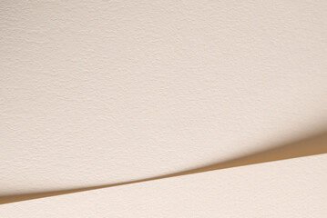 Aufkleber - A beige paper background with soft tones and gentle curves, creating a minimalist and natural aesthetic. The subtle shadows and neutral color palette enhance its warm and soothing composition. A