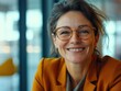 © Alexander Chaykin - Professional Woman Smiling Behind Office Space