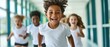 © felix_brönnimann - Children running joyfully in a brightly lit school hallway, engaging in active play and promoting physical fitness, laughter, and friendship among peers.