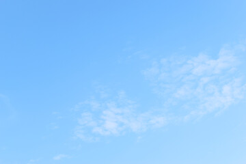 Wall Mural - beautiful blue sky and white fluffy group of clouds with sunrise in the morning, natural background