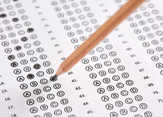 Wall Mural - Close up view of a sheet of test exam paper filled with pencil.