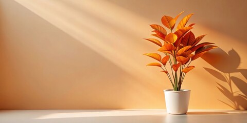 Aufkleber - A potted plant with bright orange leaves sits in a beam of sunlight against a warm, peach-colored wall.