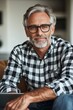 © Ilja - Confident Mature Man with Glasses Home Office Portrait, Casually Dressed, Authentic Expression.