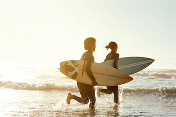 man, woman and surfing with running by sea for fitness, waves and training together in summer sunshi