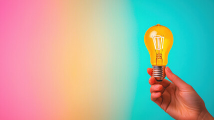 Canvas Print - hand gently holding light bulb against colorful background, symbolizing creativity and ideas. vibrant colors evoke sense of inspiration and innovation