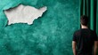 © Mikus - a man standing in front of a green wall with a hole in it, wearing a black t-shirt He appears to be looking at the hole, as if he is trying to figure out how to fi