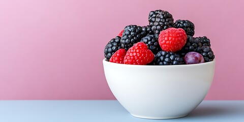 Wall Mural - Raspberries & blackberries bowl, pink backdrop