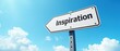 © robfolio - Directional Road Sign with 'Inspiration' Against Blue Sky with Clouds