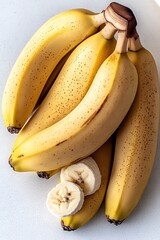 Ripe bananas sliced, bunch, white background, food photography, recipe