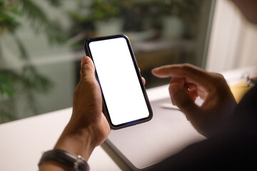 Wall Mural - hands holding smartphone with empty screen for showcasing mobile applications, advertisements, or di