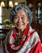 © sevenSkies - Elderly Filipino woman smiling short curly gray hair red shawl on family dining room background