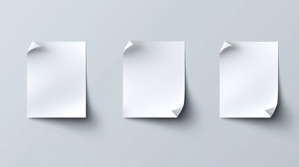 Wall Mural - three white paper sheets with curled edges on gray background for creative design minimalist aesthet