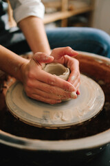 Poster - Potter creates a ceramic bowl in the pottery studio. Process of making a unique ceramic shape.