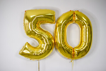 Wall Mural - gold foil balloons 50 with helium for anniversary