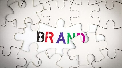 Wall Mural - brand. revealing the word by removing the puzzle pieces. stop motion, 4k