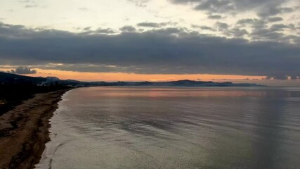 Wall Mural - Beautiful cloudscape over the sea, sunset time lapse shot