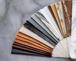 © Marufa - A fan-shaped arrangement of marble and stone samples that showcase a range of hues and textures for inspiration in interior design