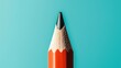 © FocusFusion - Red pencil with sharpened tip resting against a bright blue background