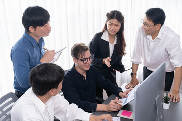 Wall Mural - Group of diverse office worker employee working together on strategic business marketing planning in corporate office room. Positive teamwork in business workplace concept. Prudent