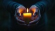 © Kitta Studio - Hands Holding Lit Candle in Darkness with Soft Glow and Warm Light