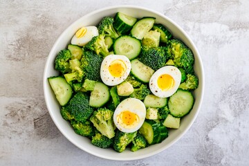 Wall Mural - Fresh vegetable salad topped with perfectly cooked eggs for a nutritious meal