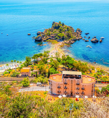 Wall Mural - Isola Bella is small island near Taormina, Sicily, Italy.  Beach in azure waters of Ionian Sea.