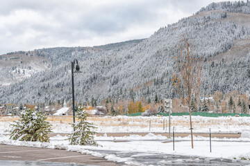 Wall Mural - Avon Colorado ski mountain town city and valley field in winter snow late fall season with mountain peak and cloudy sky