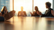 © Kateryna - Applauding Hands in Conference Room with Diverse Team