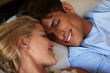 © DL/peopleimages.com - Home, couple and smile in bed to relax, bonding together and comfortable in healthy relationship. House, woman and man in bedroom for resting, sleeping and love embrace with commitment in morning