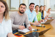 © JackF - Group of attentive students studies in the university auditorium during class, writing lecture in copybooks