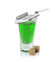 Canvas Print - Absinthe in shot glass, brown sugar and slotted spoon isolated on white