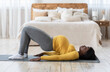 © Prostock-studio - Healthy pregnant african american woman exercising on yoga mat at home, working on her hips, copy space. Black lady future mother taking care about her body and health, doing sport