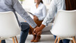 © Prostock-studio - Effective therapy concept. Back view of unrecognizable black couple holding hands and female psychologist on background in office. Family reconciling after successful psychotherapy, closeup