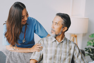 Wall Mural - Doctor holding hands of patient at hospital.