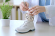 © Sung Hwan Kim - a doctor fitting a patient with an ankle brace for support after an injur