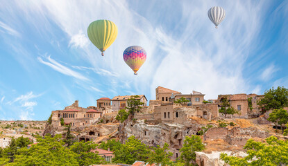 Wall Mural - Hot air balloon flying over old town Mustafa Pasha -  Cappadocia, Turkey