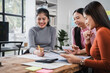 © R Photography - Asian people, motivated businesswoman at her desk, brainstorming creative ideas to kickstart her startup venture with determination and innovation. purpose and ambition. only women.