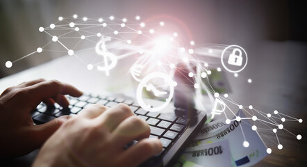 The work of a programmer and blogger on the Internet. Computer keyboard and a scattering of 100 euro bills on the table.