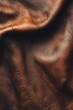 © AnasTruba - Close-up of textured brown leather with detailed wrinkles and natural grain patterns. The rich tones and organic creases highlight the depth and softness of the material, creating an abstract and tact