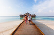 © Matteo Colombo - Adult couple walking on jetty in an island in the Maldives