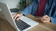© Wanda - Businessman hold credit card online payment in laptop.