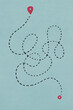 © Westend61 - A complex dotted line on a light blue map symbolizes a challenging and lengthy journey between two points