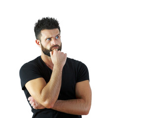Poster - Thoughtful man with beard andshirt looking up with hand on chin, isolated on a white background. Concept of decision-making or contemplation