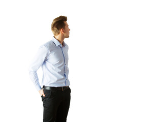 Poster - Young man in light blue shirt andpants looking to the side, hands in pockets. Isolated on white background. Concept of casual style