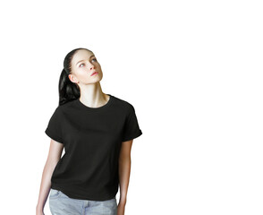 Poster - Woman wearing ashirt and light blue jeans, standing and looking upwards. Isolated on a white background. Concept of fashion or casual wear