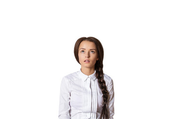 Poster - Portrait of a woman with a side braid wearing a white shirt, gazing upwards thoughtfully. Isolated on a clean white background. Concept of contemplation
